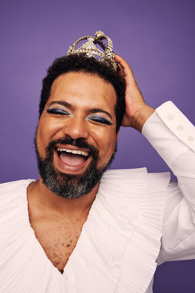 Closeup of cheerful drag queen with crown