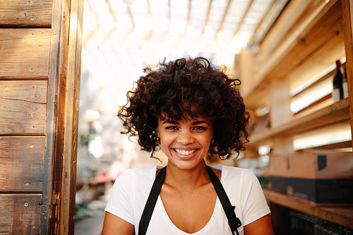 Portrait of female bartender in coffee shop