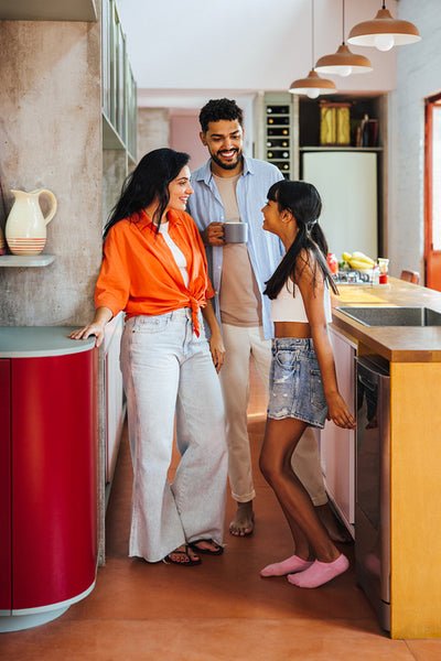 Latin American family enjoying quality time together in a modern home kitchen