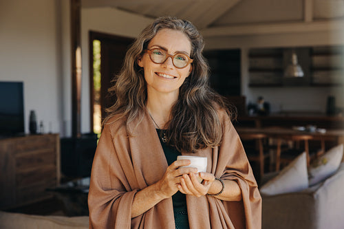 Portrait of a happy senior woman holding a cup of tea