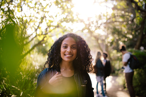 Smiling woman walking in park