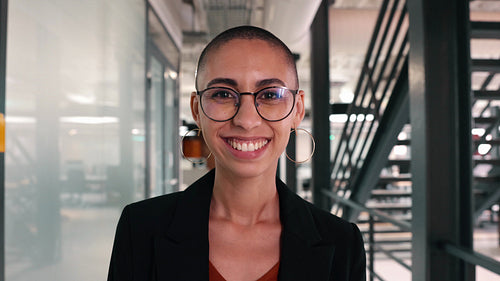 Successful young business woman smiling at the camera at work
