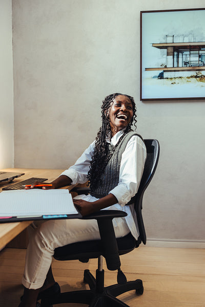 Happy architect working at a desk in a modern office space