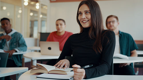 Smiling university student in classroom