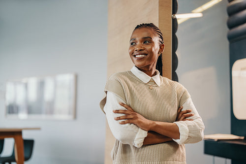 Young African female entrepreneur looking pensive in a corporate office