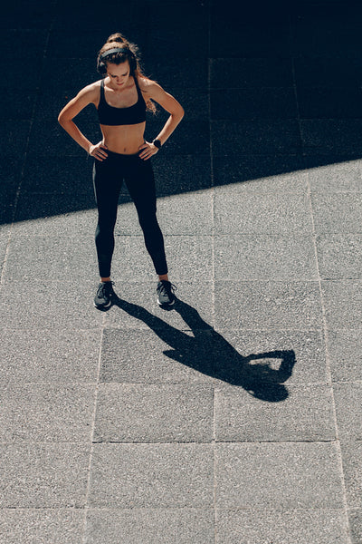 Sportswoman taking break after running workout