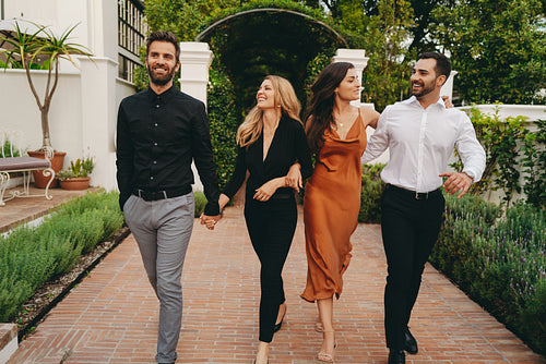 Four friends arriving at a couples retreat