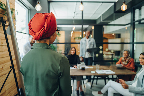 Team leader giving a speech during a meeting in an office