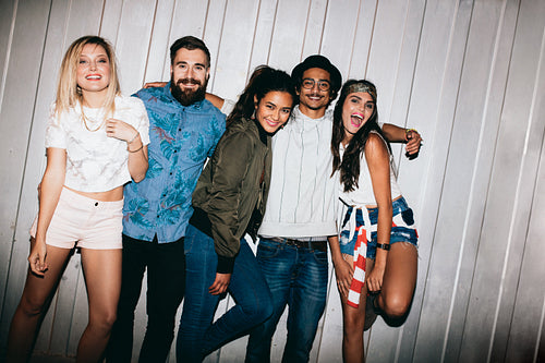 Young friends having a outdoor party at night