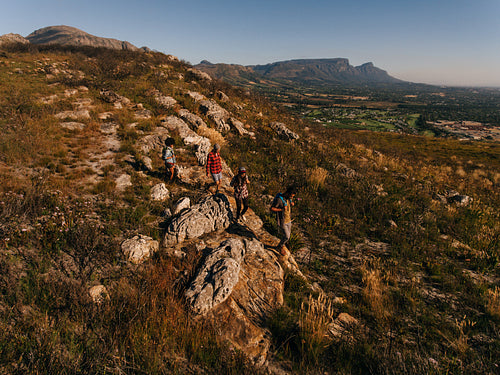 Young people through extreme terrain in countryside
