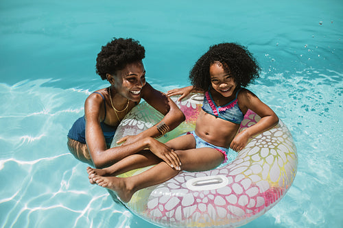 Mother and daughter in swimming pool