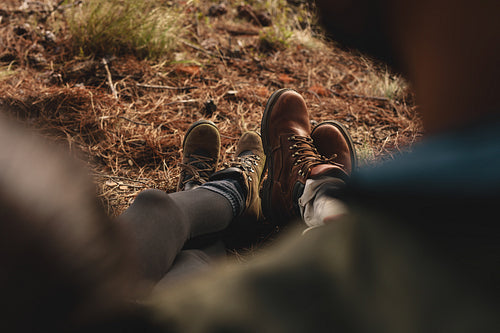Couple of hikers sitting together outdoors