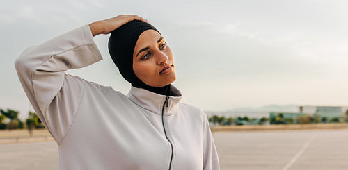 Muslim woman working out outdoors in the morning