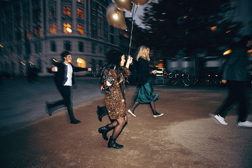 Celebration in the city with friends during an exciting evening stroll