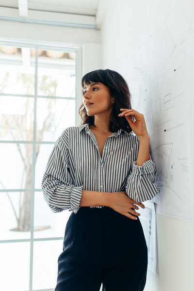 Woman entrepreneur standing in office