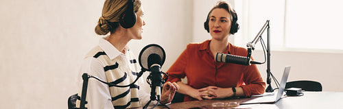 Female radio dj interviewing a guest on her show