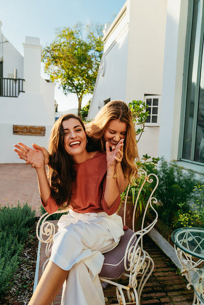 Carefree young woman surprising her friend with a visit