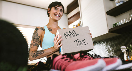 Female vlogger making mail time vlog