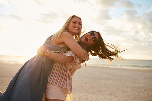 Young women vacationers enjoying on the beach