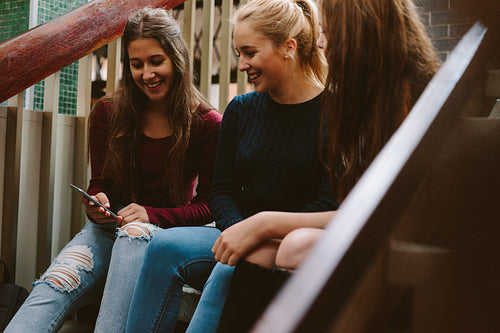 High school girls sitting on the stairs