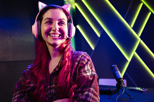 Game time: Happy female gamer live recording her gameplay on an online streaming platform
