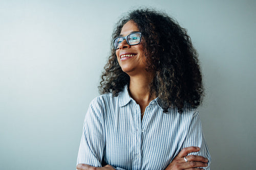 Mature businesswoman looking away and smiling