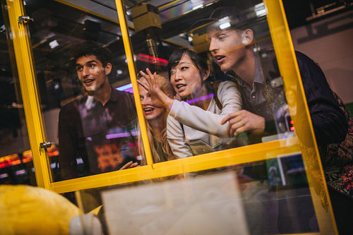 Friends playing toy grabbing game