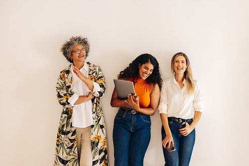 Successful businesswomen laughing happily