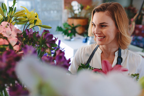Beautiful caucasian woman in flower shop
