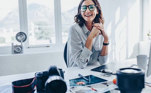 Female photo editor sitting at her desk
