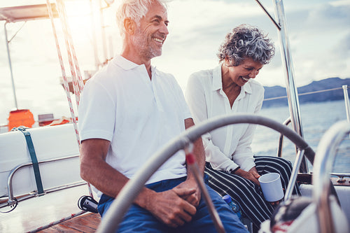 Senior couple sitting on the deck of a boat