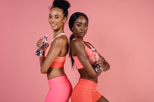 Fit young women relaxing after workout