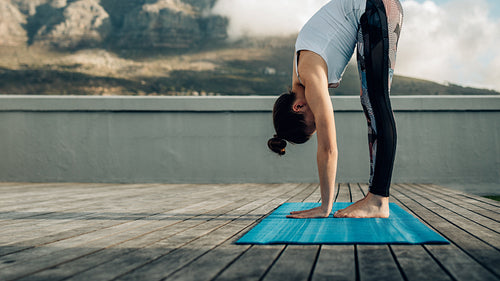 Woman practising yoga outdoors
