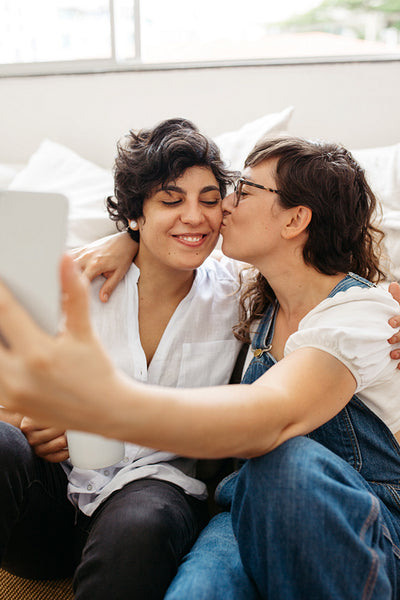 Lesbian couple taking selfie