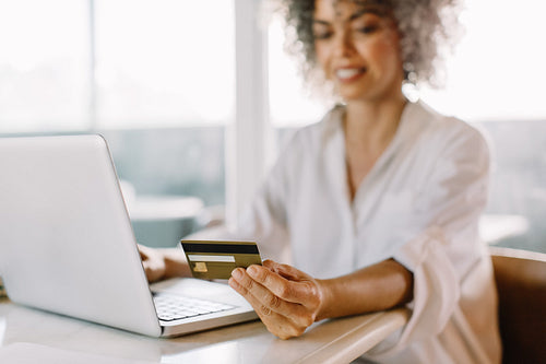 Mature woman shopping online at home