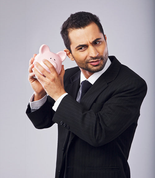 Man Holding a Piggy Bank