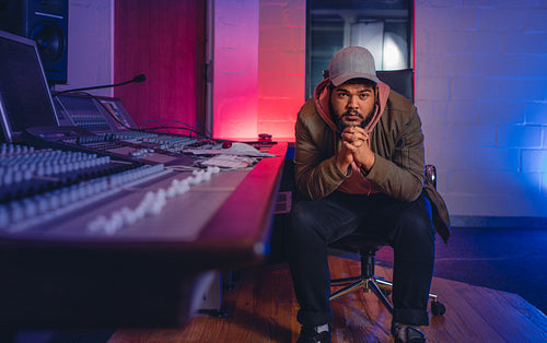 Music composer in sound recording studio