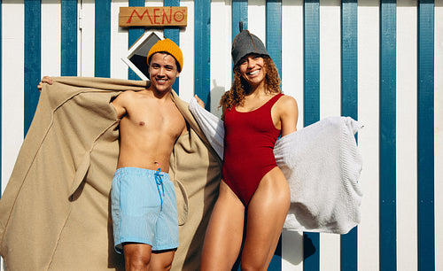 A cold therapy scene shows wellness with couple outside the sauna bathhouse