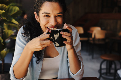 Beautiful woman enjoying a cup of coffee