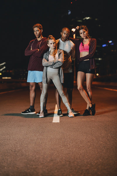 Group of runners standing together after workout