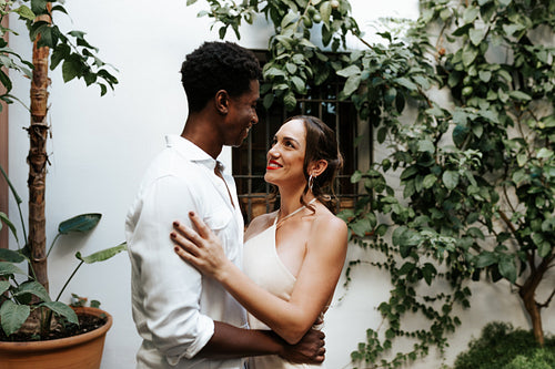 Young couple sharing a romantic moment in their backyard