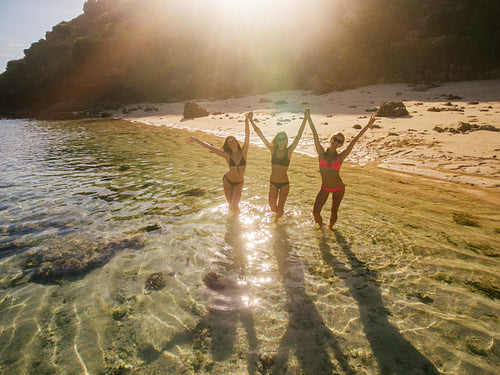 Three women having fun on beach vacation