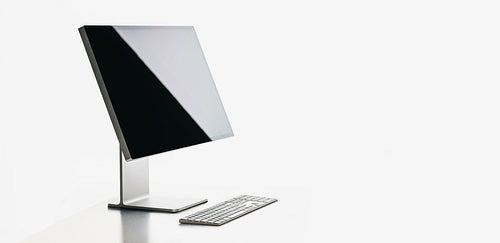 Blank desktop computer screen with sleek design for workspace mockups
