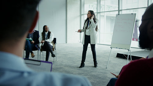 Businesswoman presenting at a corporate meeting