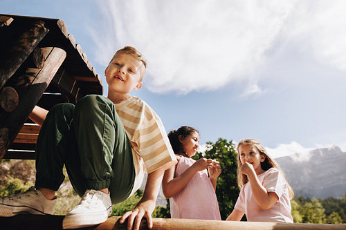 Children enjoying playtime outdoors on a sunny day in the countryside
