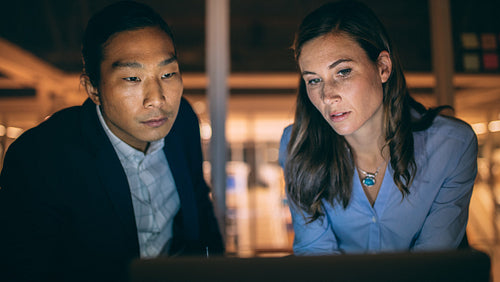 Close up of a businessman and woman working together