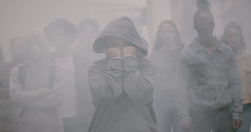 Activists protesting silently with smoke around