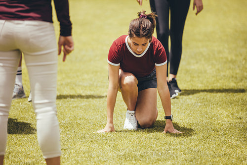 Students at sports class in school ground