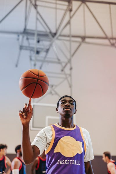 Time to shine: Confident teen poses with basketball