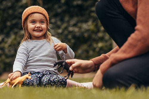 Father and daughter playing in park